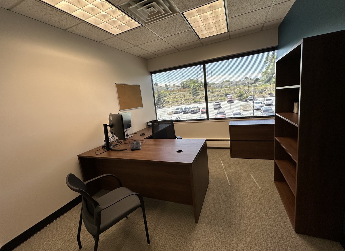 Private single office with L-desk and window at ORBIT